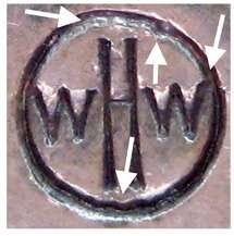 The right W almost always touches the outer circle (depending on what angle the marking die was held and the force with which it was struck).