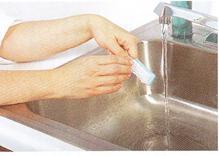 Use a paper towel or tissue to turn the water on, if you have a paper towel or tissue dispenser (some facilities only