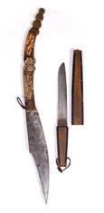 73 Batak sword Indonesian with an engraved blade, carved horn handle