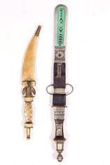 90 Tauraq dagger with leather, turquoise and silver metal handle and scabbard, 31cm and a
