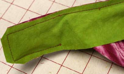 Starting at one pinned brim end, stitch ¼ around the edges to the other band