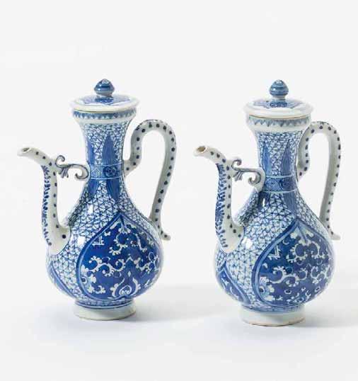 130 A pair of Chinese blue and white ewers and covers Kangxi period (1662-1722) Each in pear-shape, the sides with
