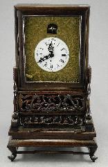 century wooden framed dresser clock.