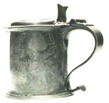 Item 408 A William and Mary lidded tankard height to lip 5 inches the domed lid with frontil extension.