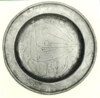 Item 409 An 8 1/2 inch diameter wriggle worked plate, engraved with a deer an acorn, tulip and foliage.
