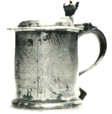 Item 417 A unique William III lidded coronation commemoration tankard. Height to lip 4 3/4 inch and overall 6 5/8 inch. Flat lidded with frontal extension which is stamped the triad IWG.
