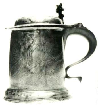 Item 418 A Charles II wriggled work lidded tankard engraved with the busts