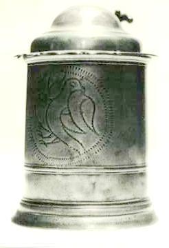 Item 520 A Queen Anne double domed lidded tankard height to lip 5 3/4 inches and overall 8 inches. The drum encircled by a narrow fillet and engraved with 2 loving birds.