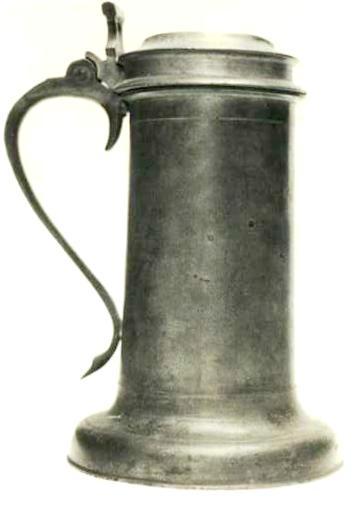 Item 521 A Cromwellian beefeater flagon with twin cusp thumbpiece. Height to lip 7 5/8 inch, overall 9 1/2 inch.