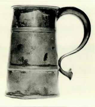 Item 527 a A William and Mary tavern tankard, height 6 1/2inch, top diameter 3 3/8inch, the body widening to 4 inch base.