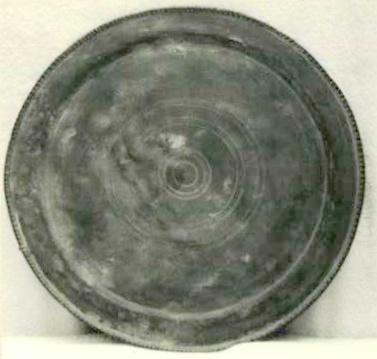 Item 530 A Roman dish of the Romano-British period c 250-400 ano. Diameter 14 1/2 inch the rim 1 1/4 inch with heavy beading.
