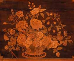with marquetry basket of flowers and fillets, counter balance, the inside lined with gold-pressed green leather, fitted interior with three compartments above a small compartment flanked by three