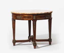 000 217 A Liège Louis XVI oak trumeau Belgium, late 18th century With a chamfered red mottled marble top, a carved wood fluted architrave with laurel festoons, corner rosettes, open tapering legs and