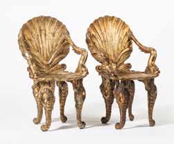 113 221 A pair of Venetian painted and part-gilt grotto chairs 20th century Each with back and seat modelled as a scallop shell, dolphin armrests