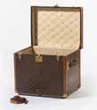 118 234 A Louis Vuitton trunk First half 20th century LV monogrammed leather and brass bound, the overall covered in LV stamped fabric, brass corners, the lock stamped Patent Louis Vuitton, 145.