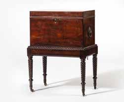 146 cm 240 An Irish mahogany wine cooler/cellarette Circa 1830 A rectangular lidded compartment, a carved profile, plain railing, four turned and twisted legs,