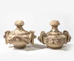 2 cm 241 Two sandstone garden ornaments 19th century Two vase-shaped finials, one with two scroll shaped handles and carved studs, one with curved handles, a