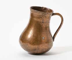 3 cm (3x) 248 A Flemish bronze measuring jug 15th century Of a pot-bellied lidless form with a rimmed edge and handle. H. 18.8 x W. 14.