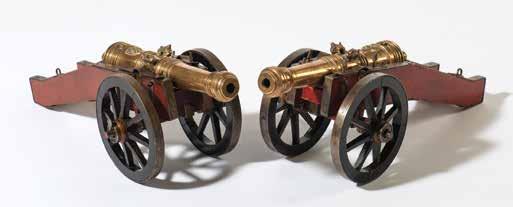 126 260 A pair of good Dutch miniature salute cannons Possibly 18th century The cast bronze barrel with a coat-of-arms and monogrammed LV
