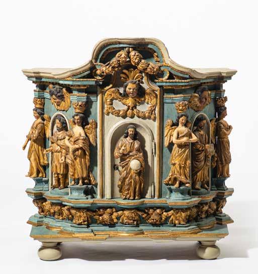 284 A rare German polychromed and giltwood tabernacle 17th century Blue polychromed, on scalloped base resting on four bun feet, above which a giltwood fluit and floral festoon motif, on the central