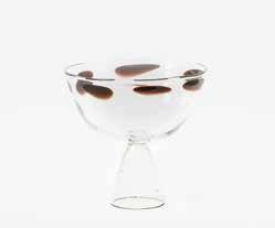 150 314 A glass coupe by Bořek Šípek 1949 2016 A white porcelain bowl with scalloped and pierced edge, four
