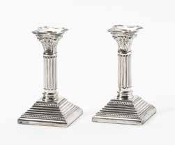 (4x) 2 A pair of German silver candlesticks Mark of Johann Philipp Heckenauer, Augsburg, 1741-43, also stamped with later Dutch marks V and ZII Each raised on a