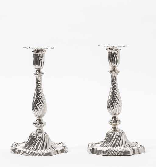 5 An elaborate pair of Dutch Rococo silver candlesticks Mark of Valentijn Caspar Beumke, Amsterdam, 1770 Each on a shaped scroll and spirally fluted domed