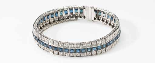 48 67 An 18 carat gold, platinum, diamond and sapphire bracelet 20th century Designed as a flexible double row of circular-cut diamonds, alternated by a line of callibré-cut sapphires, the