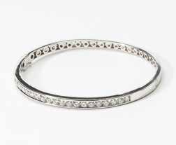 000 71 An 18 carat white gold and diamond bracelet 21st century Centered by a line of circular-cut diamonds, to a flexible ball-shaped band. Total diamond weight approx. 0.
