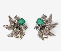 000 95 A pair of 14 carat white gold, diamond and emerald ear clips 20th century Each set with as a square-cut emerald, flanked by two square-cut diamonds,