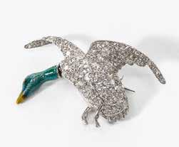 500 123 An 18 carat gold and emerald Hermès novelty brooch Circa 1970 Realistically designed as a tjilping bird, the eye emerald set. Signed Hermès Paris deposé. Emerald weight approx. 0.