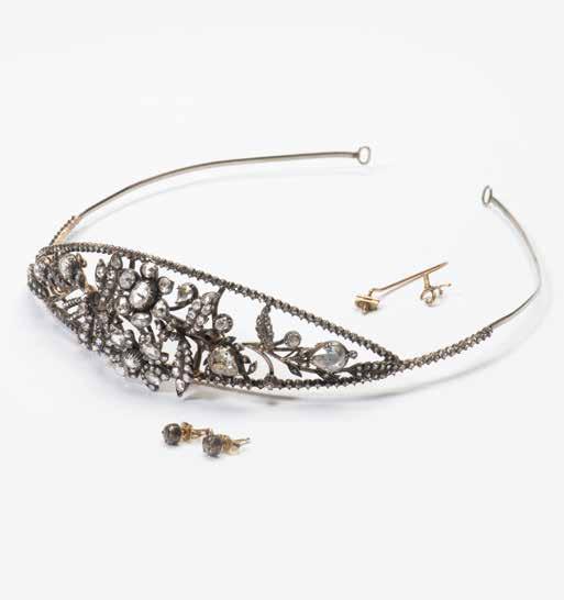 75 140 A 14 carat gold, silver and diamond tiara The Netherlands, circa 1880 Centered by an asymmetrical spray of flowers and foliage set with rose-cut diamonds, bordered by a line of rose-cut