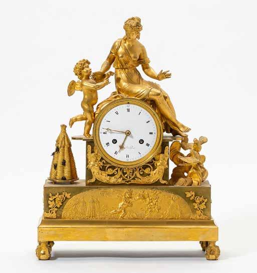 86 169 A fine French ormolu Empire mantel clock Paris, 1800-1815 Finely cast and chiselled case, surmounted by the group of Venus and Amor, flanked by doves hovering over clouds and a beehive with