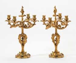 000 172 A pair of Napoleon III gilt bronze four-light candelabra Circa 1870 Each on shaped circular base, with openwork baluster