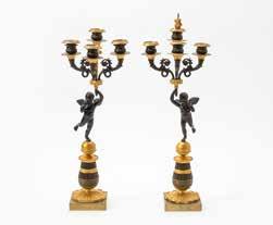 000 179 A pair of French ormolu and patinated-bronze Charles X three-light candelabra Circa 1830 Each on triangular base, with a plain column,