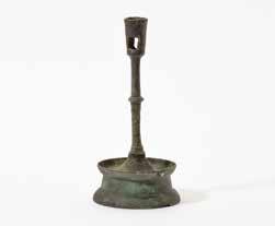 200 187 A Dutch brass candlestick 16th century With a rimmed and pierced tapering socket, a knobbed and baluster shaped stem and