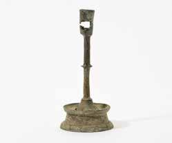 200 188 A Dutch brass candlestick 16th century With a rimmed and pierced tapering socket, a knobbed and baluster shaped stem and