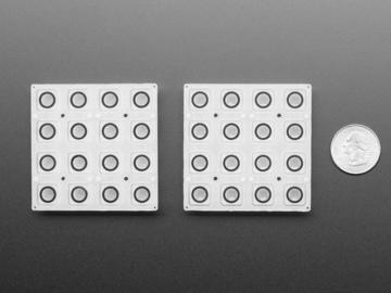 There's a 4x8 grid of elastomer button pads with a NeoPixel nestled in the center of each one.