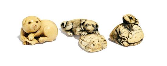 NETSUKE: WELPE MIT AWABI-MU- SCHEL. Japan. Edo period. Late 18th c. Maritime ivory with partly golden yellow patina. The young male puppy huddled over his prey, a large Awabi shell. Width 7cm.