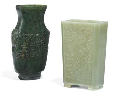 It is connected in a butterfly from which a pendant hangs. The lid with onion-shaped handle. All cut from one piece of jade. The surface of the vase with flowering peonies and birds in bas-relief.