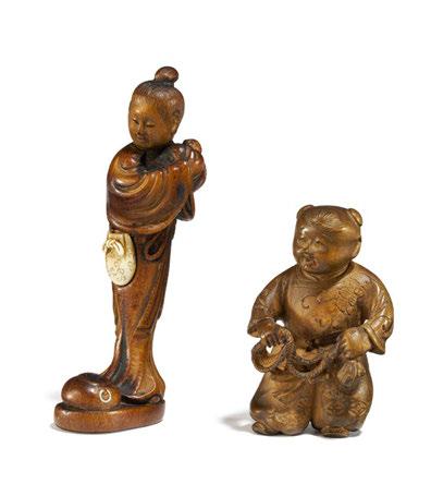 The himotoshi cleverly hidden in a pouch separately carved from ivory and attached to the belt. Height 7.2cm. Sign.: Hôjitsu, cf. MCI pp.168. Condition A. 2299 NETSUKE: KARAKO WITH CORD.