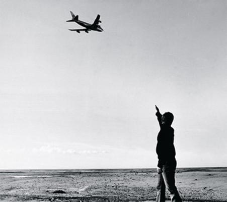 747. Chris Burden. Jan. 5, 1973. Performance near LAX, Los Angeles. "At about 8:00 a.m. at a beach near the Los Angeles International Airport, I fired several shots with a pistol at a Boeing 747," Burden said of the performance.