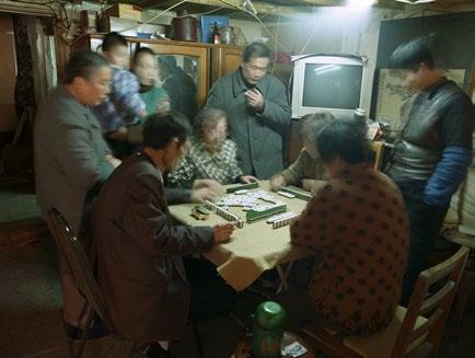 Hu Yang (b. 1959) depicts the continuous change and huge social differences that exist in his native Shanghai in his photographic series Shanghai Living.