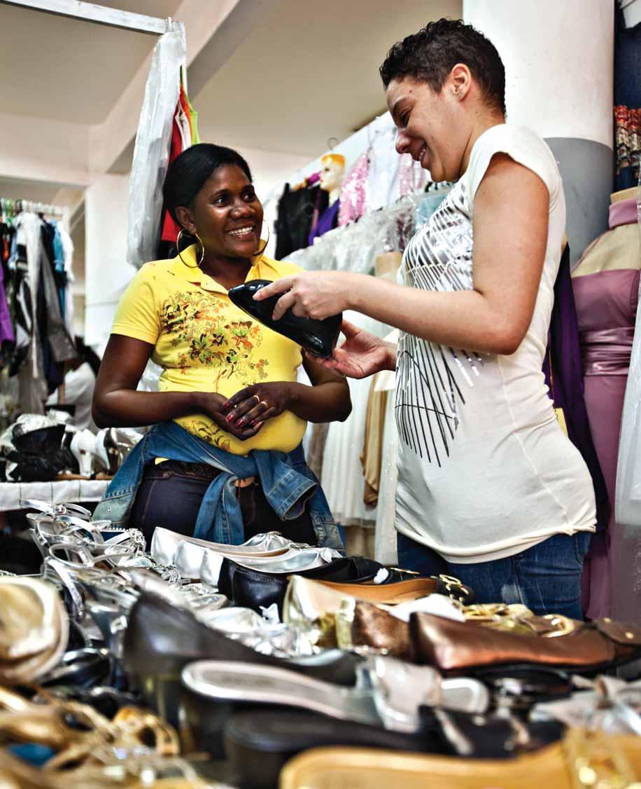 MICROCREDIT Happy customer: Maria José sells a handbag Jose Silva Pinto Afew years ago, Maria José had a small stall in Luanda s crowded open air Roque Santeiro market and she struggled to make ends