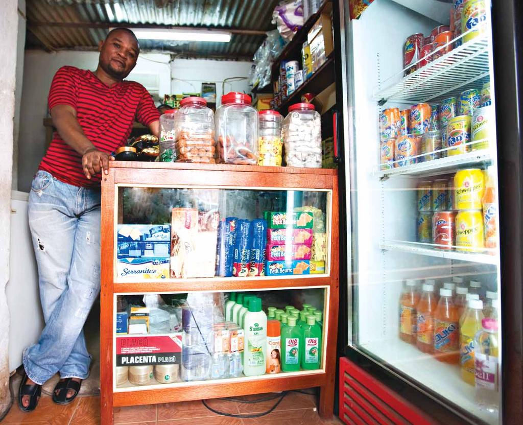 MICROCREDIT António da Silva: I am a good manager OPEN FOR BUSINESS António da Silva s cantina is small and compact, the wooden shelves of the shop neatly stacked with colourful tins, bottles and
