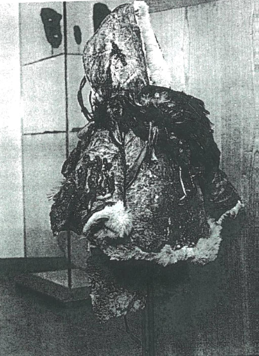 Fig. 2. Display of the amulet costume as from 1992, mounted on cotton-covered support.