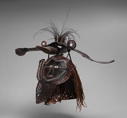 The masks are made from turtle-shell plates, carefully shaped and curved, then lashed together and usually decorated with incised patterns infilled with white ocher.