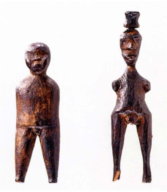 Male and female figures carved in driftwood and found in an old grave by W.A.