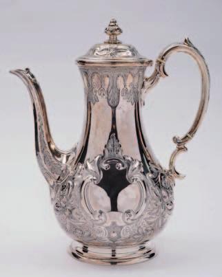 83 82. A George III Scottish silver mustard pot of cylindrical outline, crested to the hinged lid, with ribbon and garland decoration, 6.5cm.