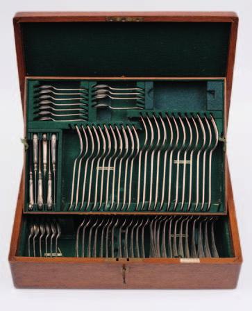 41. A George V canteen of Louis XVI pattern flatware, comprising:- twelve table spoons, twelve table forks, eleven dessert forks, twelve dessert spoons, six egg spoons, eleven teaspoons, two sauce